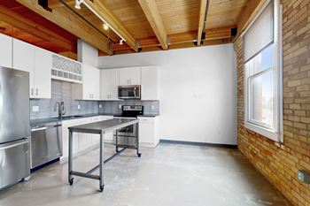 Exposed original brick and timber